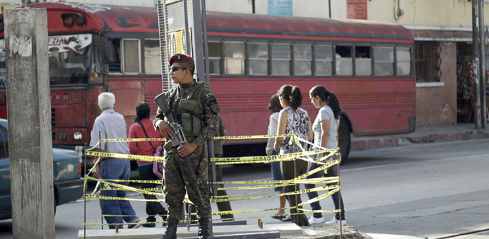 A soldier stands guard near a polling station in Guatemala City.