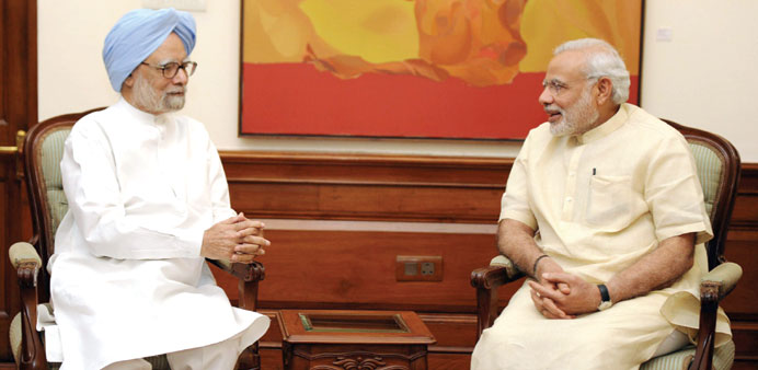 Former Indian prime minister Manmohan Singh  speaking with current Indian Prime Minister Narendra Modi  during a meeting in New Delhi last week.