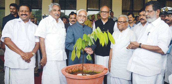 Ansari who planted a sapling in the assembly premises is seen with Governor Nikhil Kumar, Chief Minister Chandy, opposition leader Achuthanandan and S