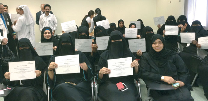 Some Front Office staff show off their certificates during the ceremony.