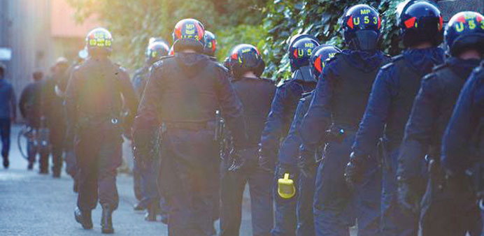  Police line up for the raids yesterday morning