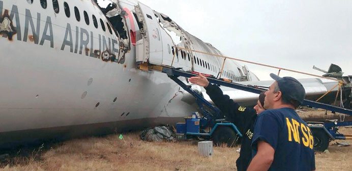 In this photo provided by the National Transportation Safety Board (NTSB), Hersman and lead investigator Bill English survey the crash site of Asiana 