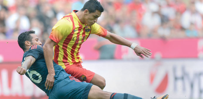 Bayern Munichu2019s Spanish midfielder Thiago Alcantara (left) and Barcelonau2019s Chilean midfielder Alexis Sanchez vie for the ball during the u201cUli Hoeness 
