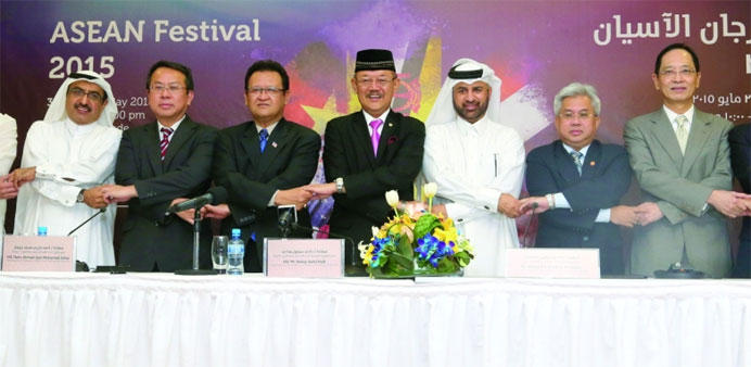 Asean envoys and Katara officials join hands to announce the launching of the first Asean Festival in Qatar. PICTURE: Jayan Orma.