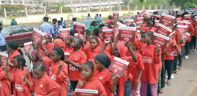 Children under the auspices of Chibok Girls Ambassadors march in Abuja to press for the release of 219 schoolgirls, abducted by Boko Haram Islamists m