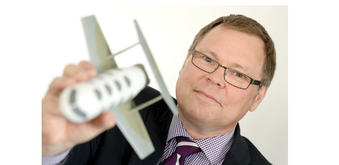    PROMISE: Joachim Lau, chief executive of the Hamburg company V-Plane, holds a model of the suborbital aircraft designed by his German firm.
