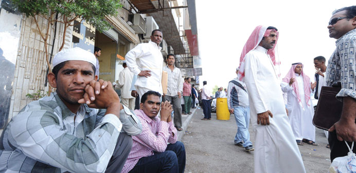 Foreign workers outside the Saudi immigration department waiting for an exit visa.