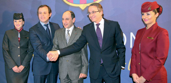 Al-Baker with Rosell (left), club vice-president for economy and strategy Javier Faus, and cabin crew following the news conference in Barcelona.