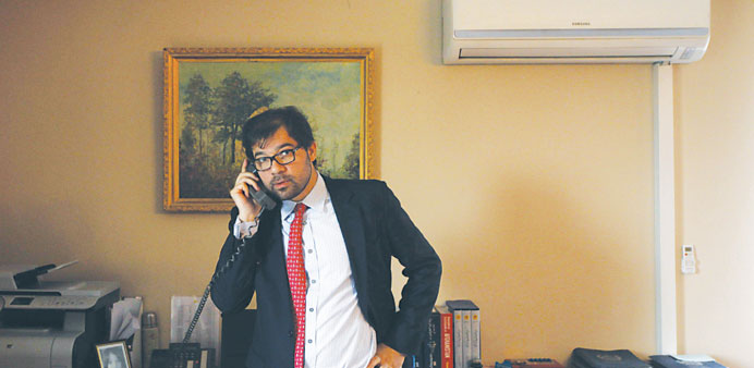 Afghanistanu2019s Deputy Foreign Minister Jawed Ludin talks on the phone before an interview in Kabul yesterday.