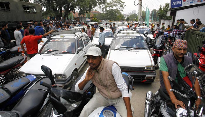 Motorists line up outside a gas station as fuel rations  implemented in Kathmandu, September 28, 2015. Reuters