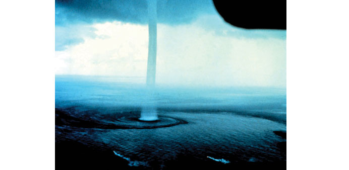POSSIBLE EXPLANATION:  File photo of a waterspout near Florida. Waterspouts, it is believed, can account for at least some instances of fishes and oth
