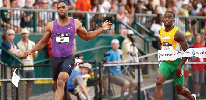 Tyson Gay (left) crosses the finish line ahead of Trayvon Bromell to win the 100M during USA Track & Field Championships in Eugene, Oregon. (AFP)