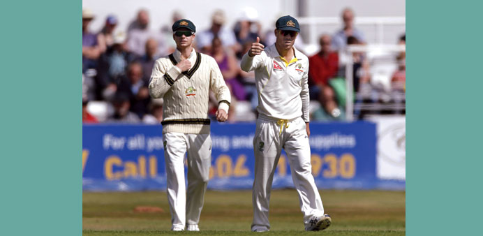 David Warner (right).
